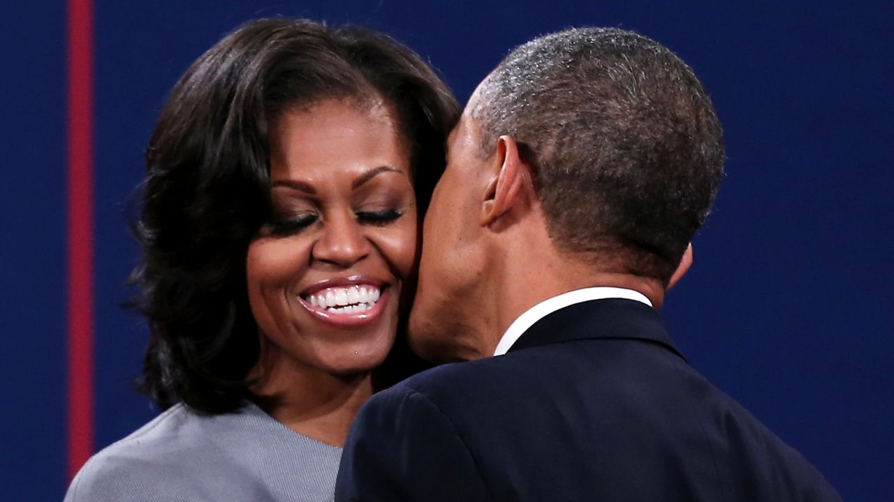 President Obama greets first lady Michelle Obama.