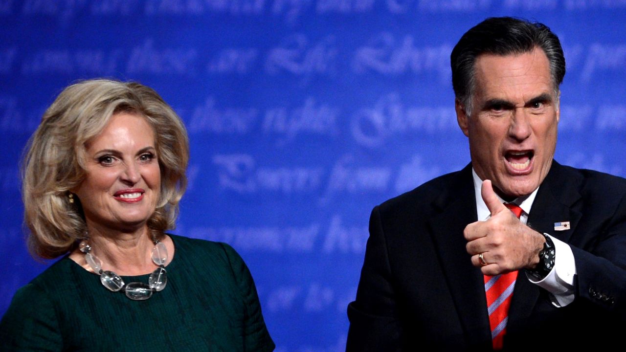Romney gestures beside his wife, Ann, on Monday.