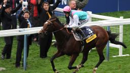 British colt Frankel powers home to take the Champion Stakes at  Ascot -- his 14th consecutive win.