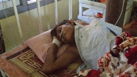 An injured Buddhist man lies in a hospital in Sittwe, capital of Myanmar's western Rakhine state on October 23, 2012.