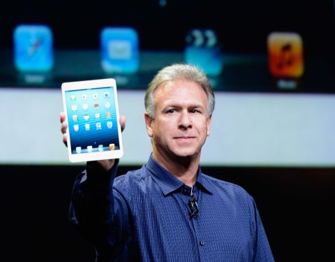 Apple marketing chief Phil Schiller holds up an iPad Mini, revealed during an announcement on Tuesday.