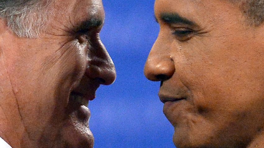 U.S. President Barack Obama (R) greets Republican presidential candidate Mitt Romney (L) following the third and final presidential debate at Lynn University in Boca Raton, Florida on October 22, 2012