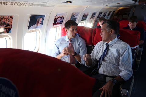 Romney talks with his running mate Rep. Paul Ryan of Wisconsin aboard their campaign plane on Tuesday, October 23, en route to Denver. A day after the final presidential debate, Romney is campaigning in Nevada and Colorado.