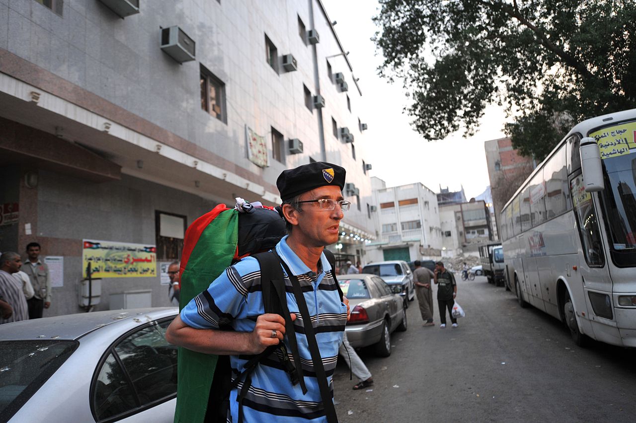 Bosnian Muslim pilgrim Senad Hadzic, 47, who left December on a pilgrimage to Mecca by foot, walks in the holy city on Tuesday. Hadzic said he had walked through Bosnia, Serbia, Bulgaria, Turkey, Syria and Jordan with a backpack weighing 20 kilograms, or 44 pounds.