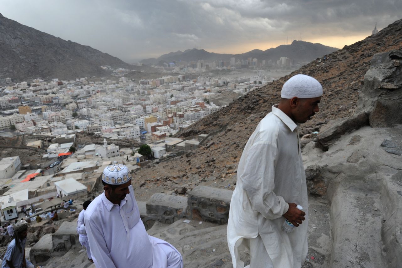 Muslim pilgrims walk up Jabal al-Noor, the "Mountain of Light," overlooking the holy city of Mecca, on Sunday, October 21.