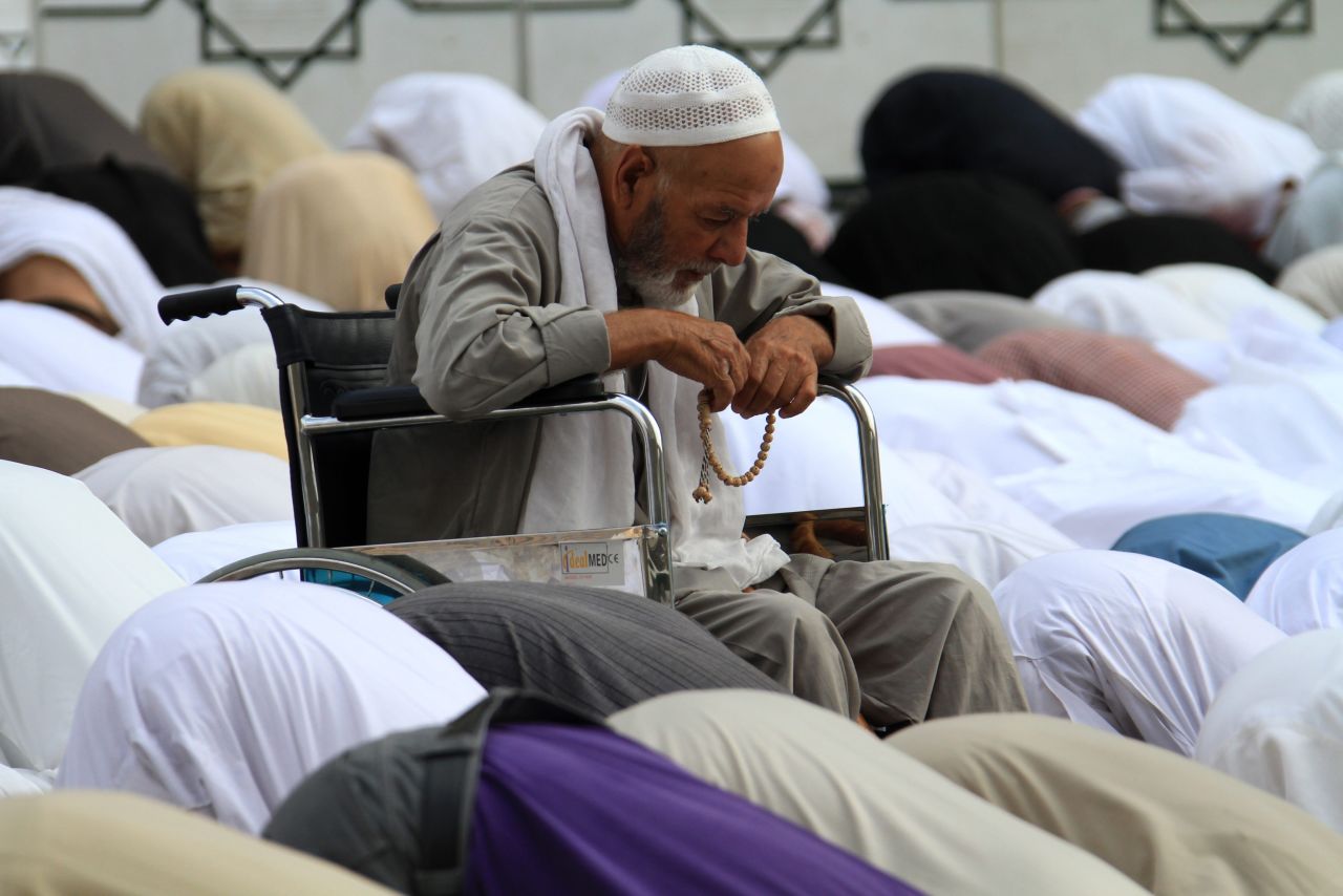 A Palestinian pilgrim prays near the Haram Sharif Great Mosque in Mecca, Saudi Arabia, on Tuesday, October 23.