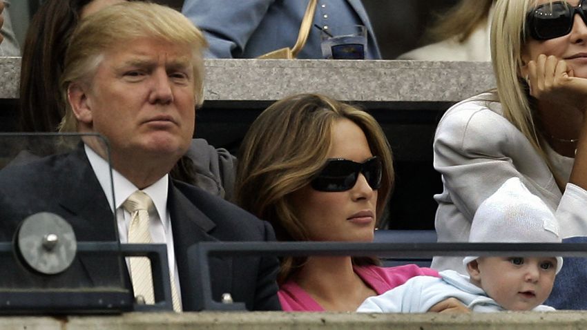 FLUSHING MEADOWS, UNITED STATES:  US real estate tycoon Donald Trump, his wife Melania Knauss and their baby Barron William Trump attend the 2006 US Open men's final between Switzerrland's Roger Federer and Andy Roddick of the US at the USTA National Tennis Center in Flushing Meadows, New York, 10 September 2006.  AFP PHOTO/Timothy A. CLARY  (Photo credit should read TIMOTHY A. CLARY/AFP/Getty Images)