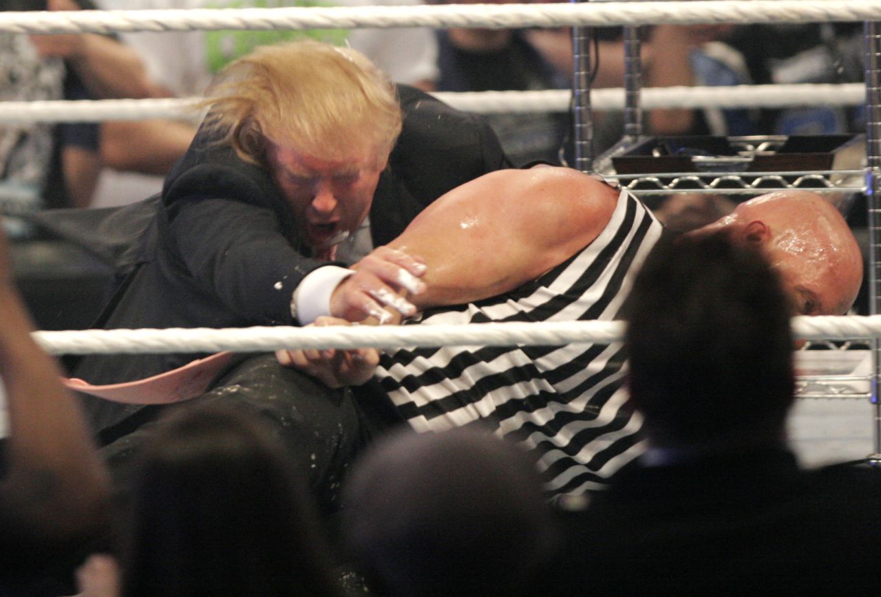 Trump wrestles with "Stone Cold" Steve Austin at WrestleMania in 2007. Trump has close ties with the WWE and its CEO, Vince McMahon.