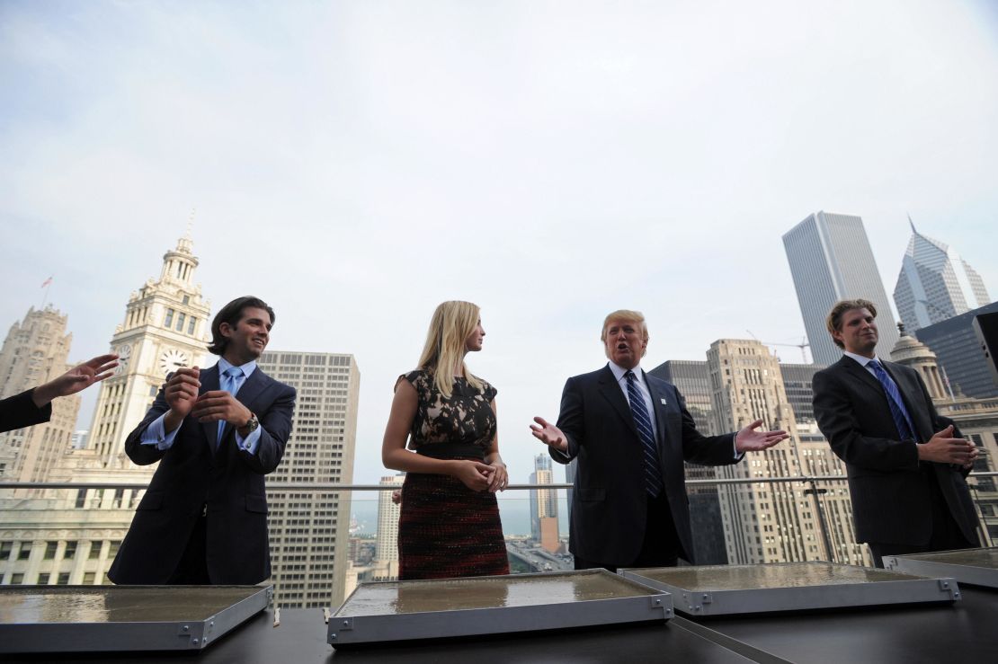 Donald Trump and his children (L-R) Donald, Jr., Ivanka and Eric prepare to make hand prints during a press conference at the Trump International Hotel and Tower in Chicago on September 24, 2008.