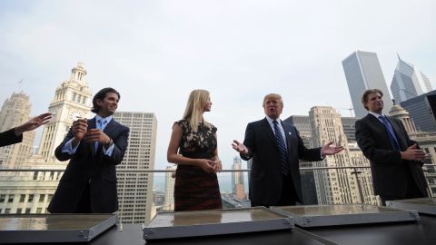 Donald Trump and his children (L-R) Donald, Jr., Ivanka and Eric prepare to make hand prints during a press conference at the Trump International Hotel and Tower in Chicago on September 24, 2008.