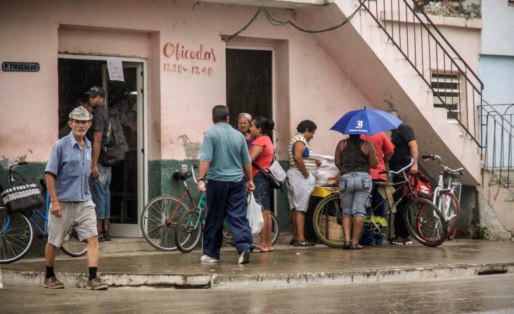 Citizens of Bayamo, Cuba, buy food on Wednesday, as they prepare for the arrival of Hurricane Sandy.
