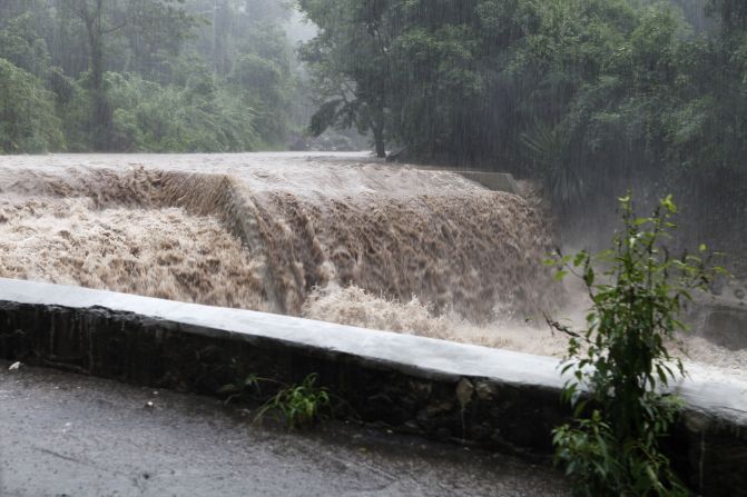 The Hope River begins to swell with rain from approaching Hurricane Sandy in Kingston on Wednesday.