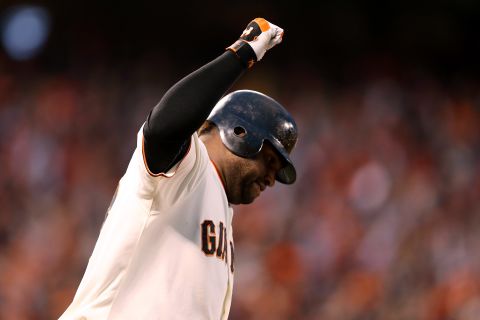 Pablo Sandoval of the San Francisco Giants rounds the bases after hitting a two-run home run to left field against Justin Verlander of the Detroit Tigers in the third inning.