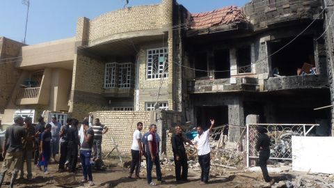 Iraqis inspect damage after multiple mortars struck the Chikuk neighbourhood in Baghdad on October 23, 2012.