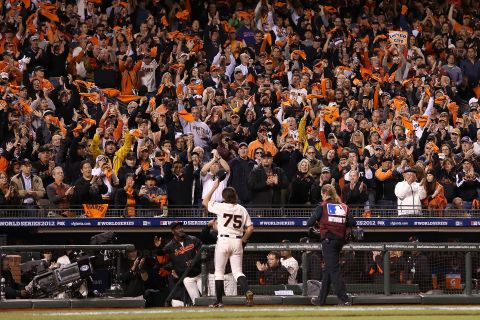 Barry Zito of the San Francisco Giants waves to the crowed as he walks to the dugout after being relieved by Tim Lincecum in the sixth inning.