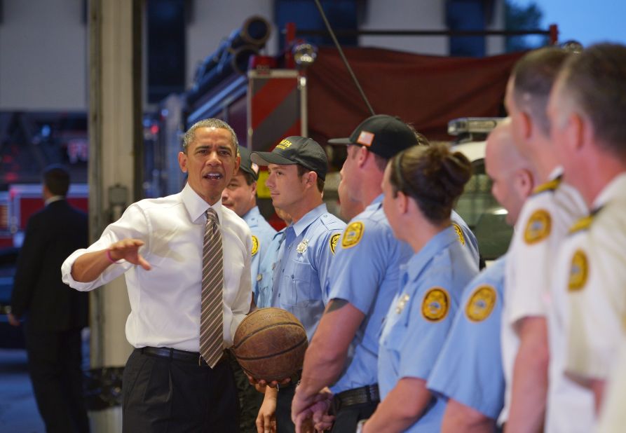 Obama chats with firefighters after dropping off doughnuts for them at a fire station in Tampa, Florida, on Thursday, October 25.