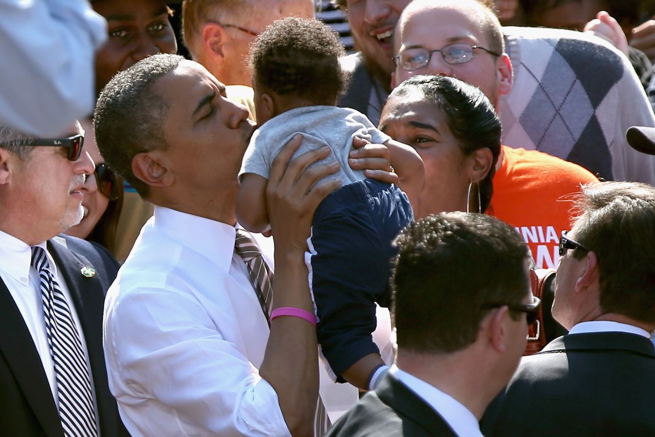 Obama kisses a baby during a campaign rally at Byrd Park in Richmond, Virginia, on Thursday.