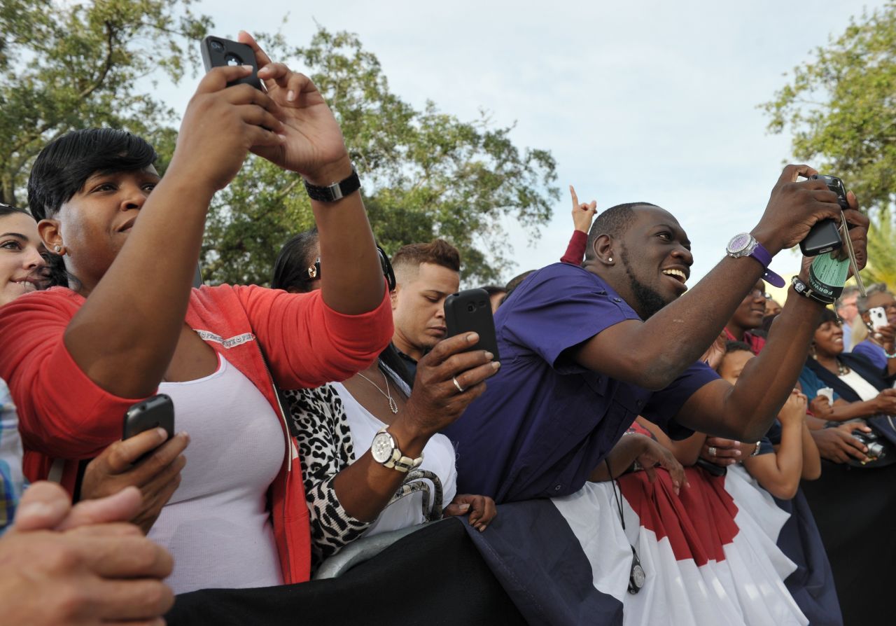 Supporters take photos of Obama during a campaign rally at Ybor City Museum State Park in Tampa on Thursday.