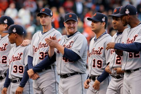 Phil Coke, center, and the Detroit Tigers are introduced before the start of the game.