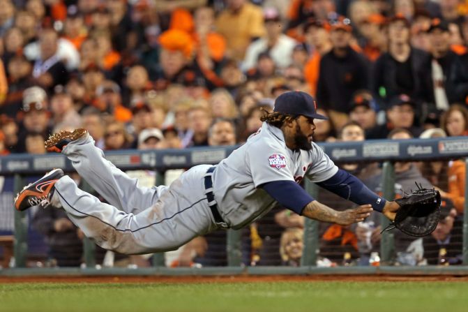 Prince Fielder of the Detroit Tigers dives for a foul ball and misses.