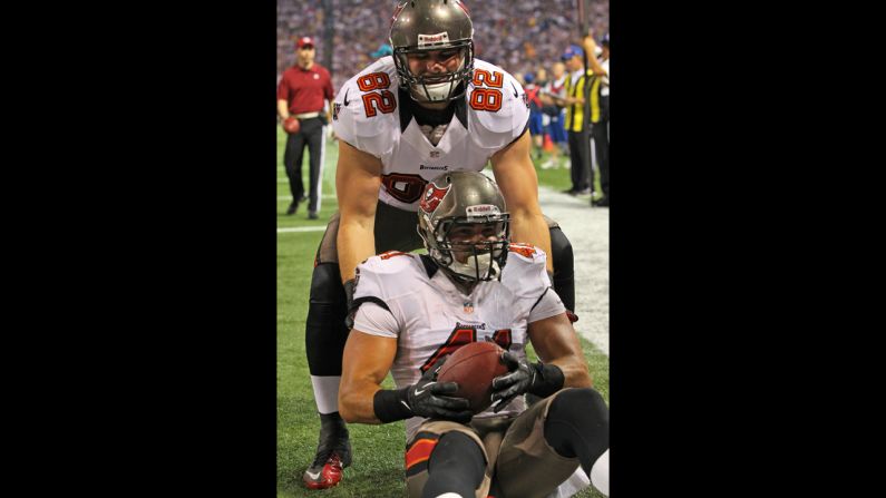 Erik Lorig and Nate Byham of the Tampa Bay Buccaneers celebrate Lorig's touchdown against the Minnesota Vikings on Thursday.