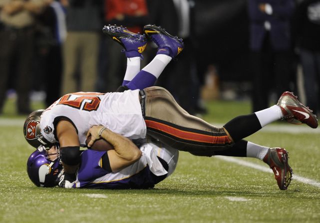 Christian Ponder of the Minnesota Vikings is sacked by Daniel Te'o-Nesheim of the Tampa Bay Buccaneers during the second quarter of the game Thursday.