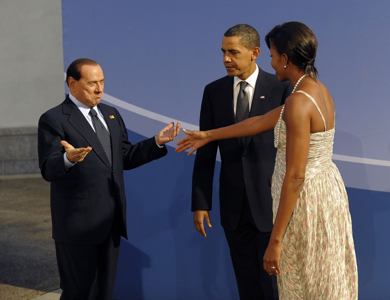 President Barack Obama and first lady Michelle Obama welcome Berlusconi to a G20 dinner in Pittsburgh in September 2009.