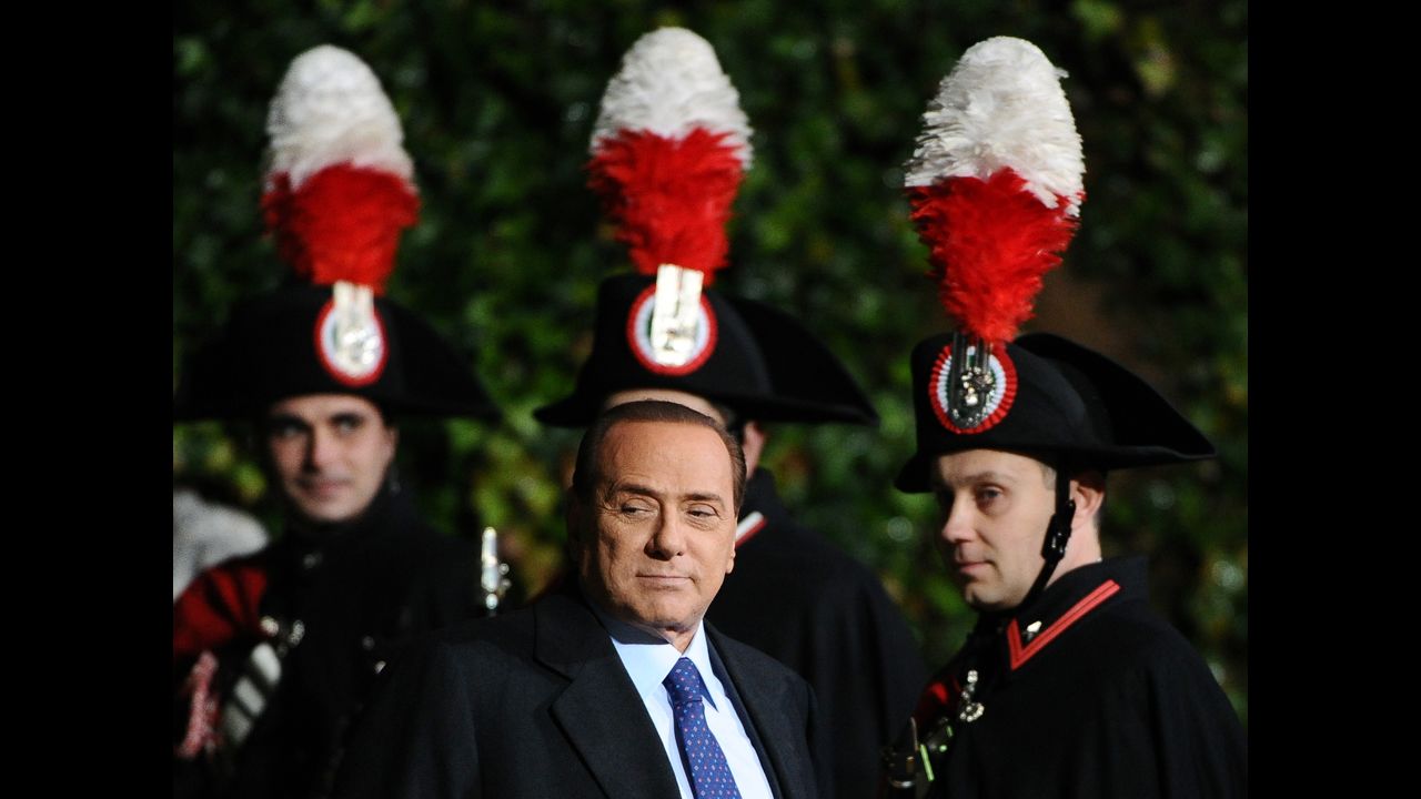 Berlusconi passes by Carabinieri guards before a meeting with Russia's President at Villa Madama in February 2011.