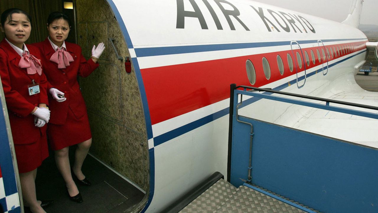 Flight attendants are seen inside an Air Koryo jet in this file photograph.