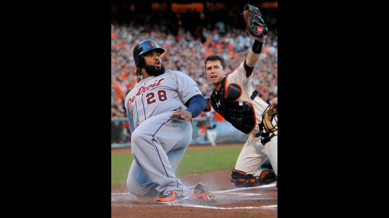 Prince Fielder of the Detroit Tigers is tagged out at home plate by catcher Buster Posey of the San Francisco Giants in the second inning.