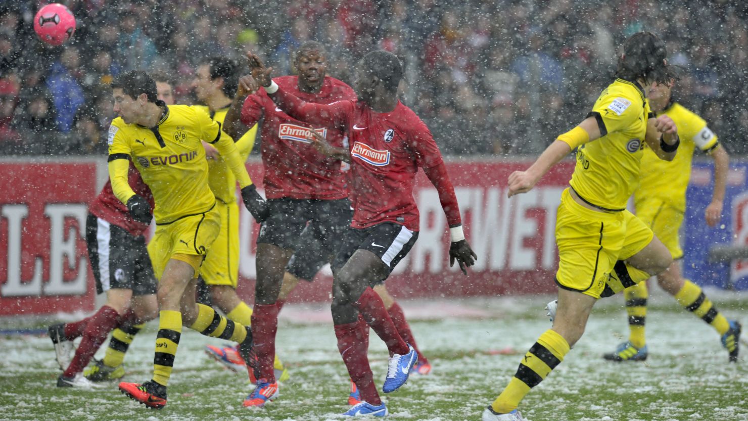 Neven Subotic (right) scores Dortmund's opening goal against Freiburg on Saturday.