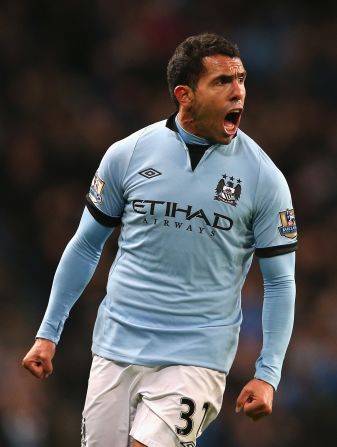 Carlos Tevez celebrates after scoring the only goal in Manchester City's 1-0 win at home to Swansea.