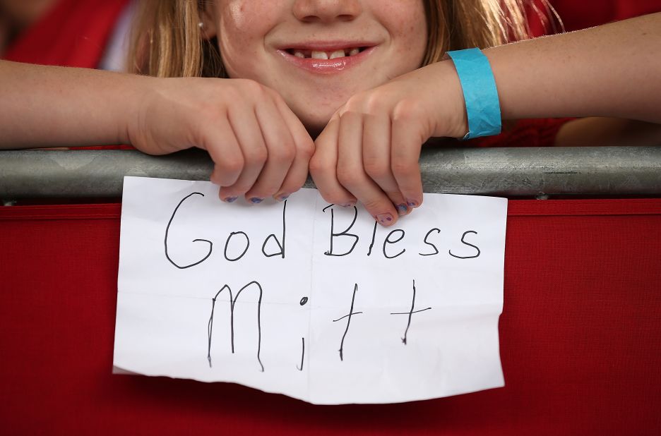 A young Romney supporter holds a homemade sign during a campaign rally at Ranger Jet Center on Saturday in Kissimmee, Florida.
