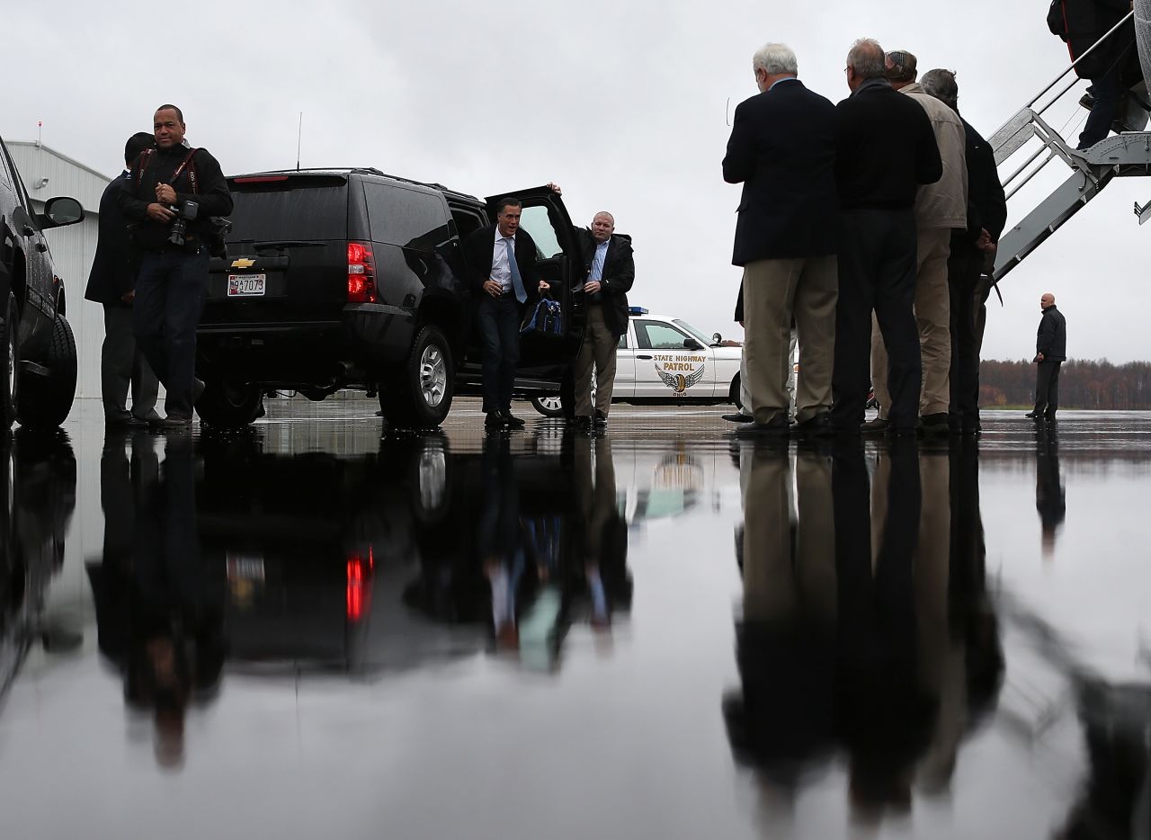 Romney emerges from his SUV at Akron-Canton Regional Airport on Saturday in Canton, Ohio.