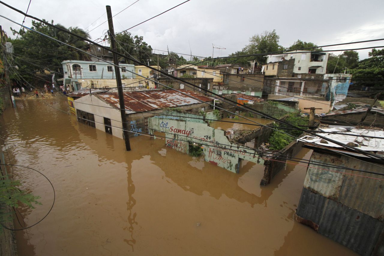 Houses are flooded in the neighborhood of La Javilla in Santo Domingo, the capital of Dominican Republic, on Friday.