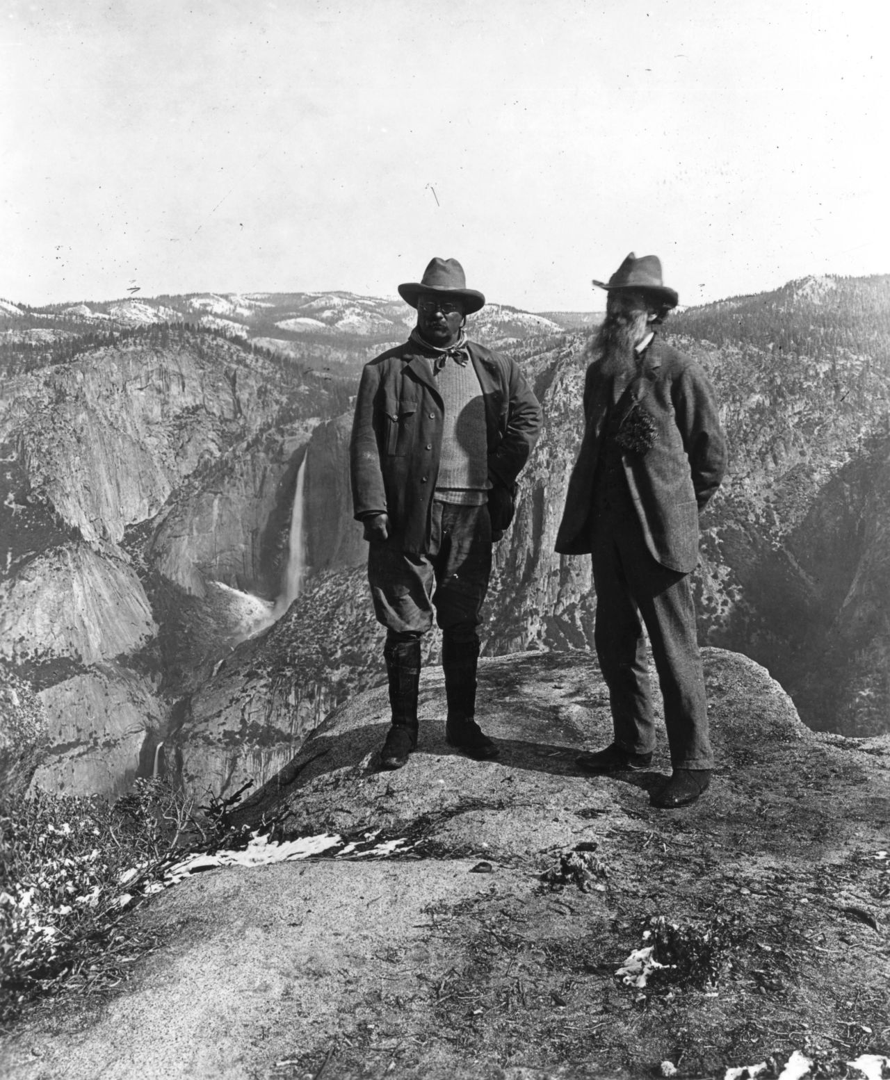 Theodore Roosevelt, left, poses with the conservationist John Muir on Glacier Point in Yosemite, California. Roosevelt was the first president to extensively preserve national forests and parks.