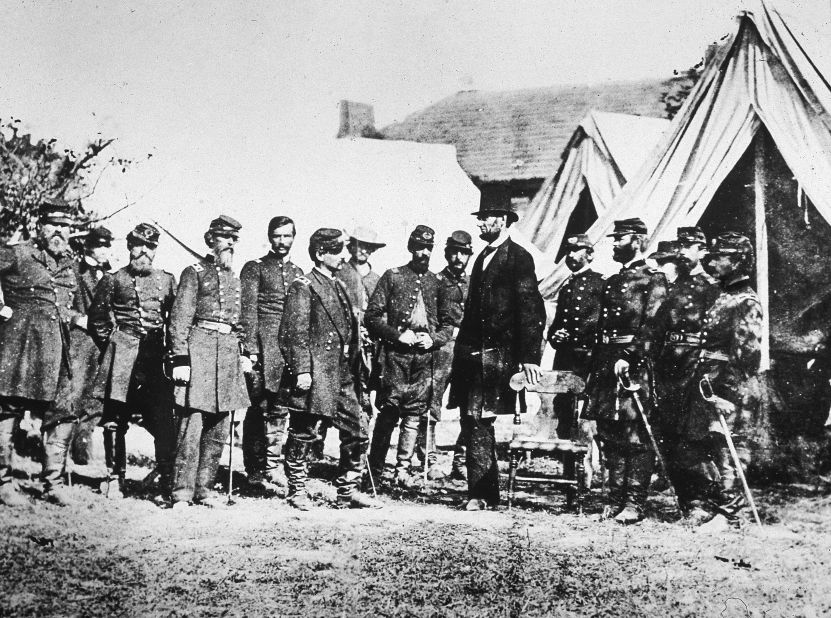 Abraham Lincoln meets with Gen. George McClellan, sixth from left, and his Union troops at Sharpsburg, Maryland, following the Battle of Antietam on October 3, 1862. 