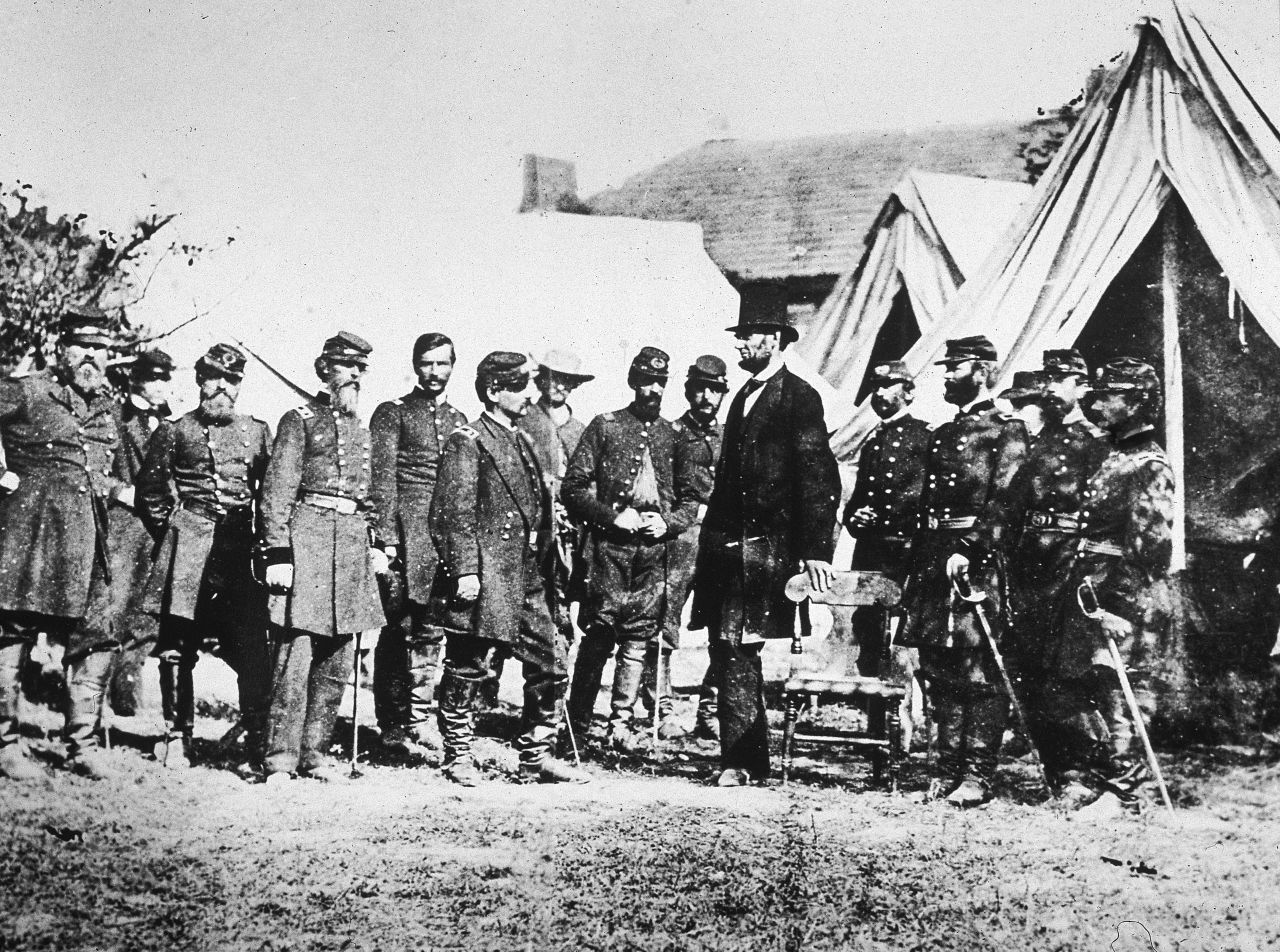 Abraham Lincoln meets with Gen. George McClellan, sixth from left, and his Union troops at Sharpsburg, Maryland, following the Battle of Antietam on October 3, 1862. 