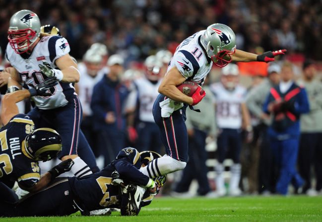 Rodney McLeod of the Rams tackles Julian Edelman of the Patriots during Sunday's game.
