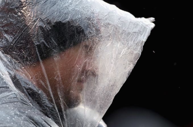 A Cleveland Browns fan braves the wind and rain before their game against the San Diego Chargers in Cleveland on Sunday.