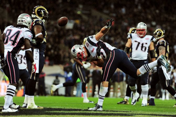 Rob Gronkowski of the New England Patriots celebrates by spiking the ball after scoring his team's third touchdown against the St. Louis Rams on Sunday at Wembley Stadium in London.