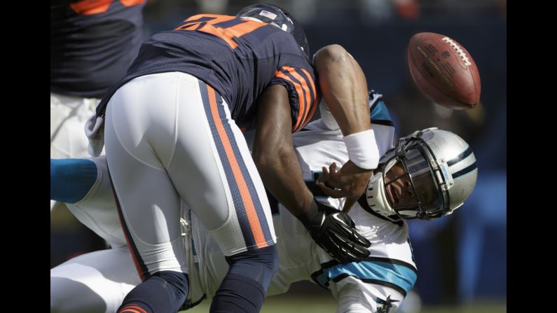 Cam Newton of the Panthers fumbles the ball while being tackled by Major Wright of the Chicago Bears on the goal line on Sunday. The Panthers recovered the ball and scored a touchdown on the play.