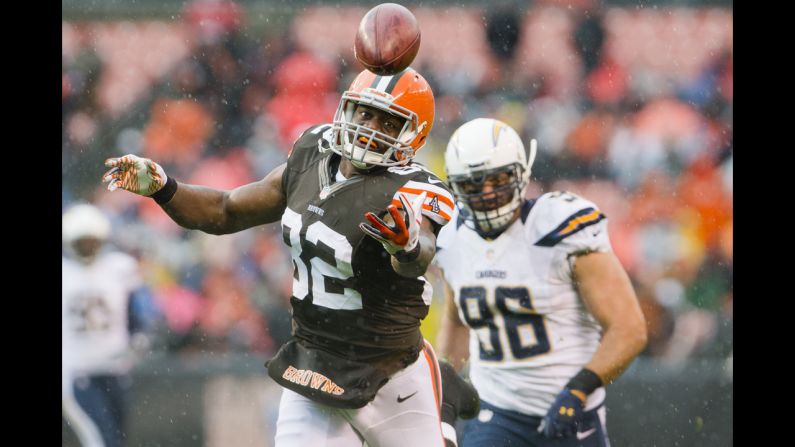 Tight end Benjamin Watson of the Cleveland Browns can't reel in a pass from quarterback Brandon Weeden under pressure from linebacker Antwan Barnes of the San Diego Chargers during the first half at Cleveland Browns Stadium on Sunday, October 28, in Ohio.