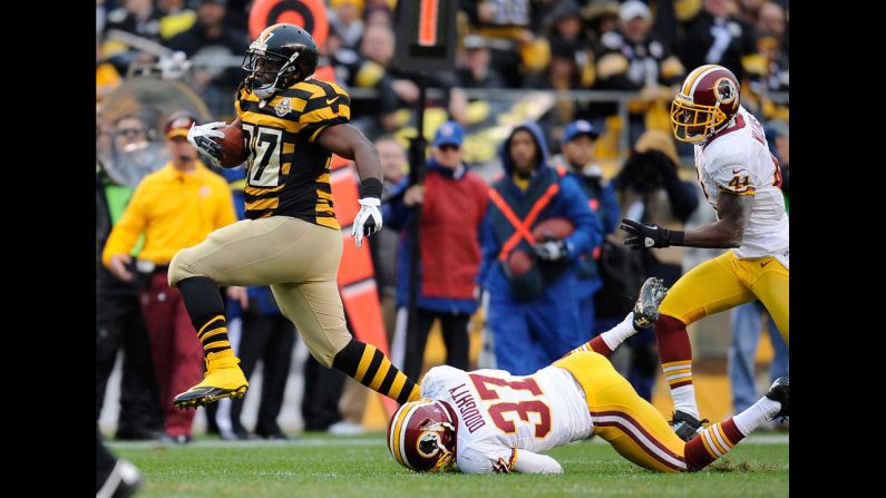 Jonathan Dwyer of the Pittsburgh Steelers avoids a tackle by Reed Doughty of the Washington Redskins on Sunday at Heinz Field in Pittsburgh.