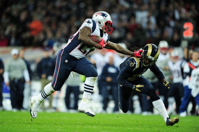 Stevan Ridley of the New England Patriots pushes Janoris Jenkins of the St. Louis Rams during Sunday's game at Wembley Stadium on Sunday in London.