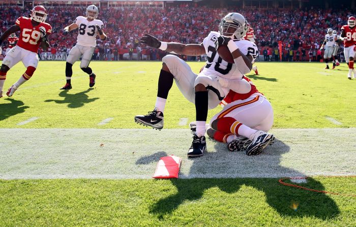 Running back Darren McFadden of the Raiders is tackled out-of-bounds at the first-down marker during the game against the Chiefs on Sunday.