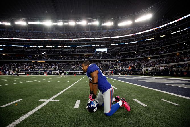 Michael Boley of the Giants celebrates on the field after beating the Cowboys.