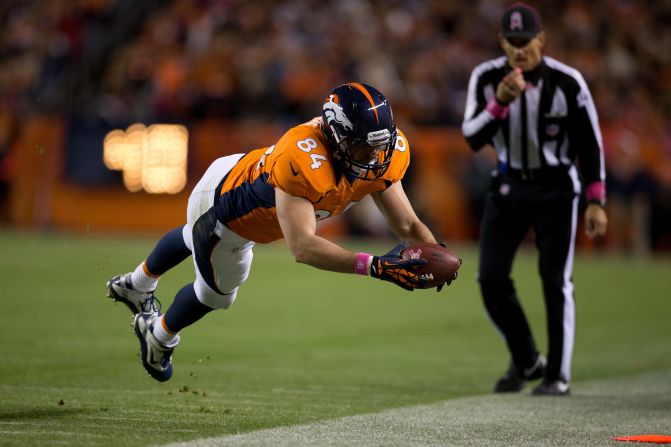 Tight end Jacob Tamme of the Denver Broncos dives for a first down during the first quarter against the New Orleans Saints at Sports Authority Field at Mile High on Sunday in Denver.