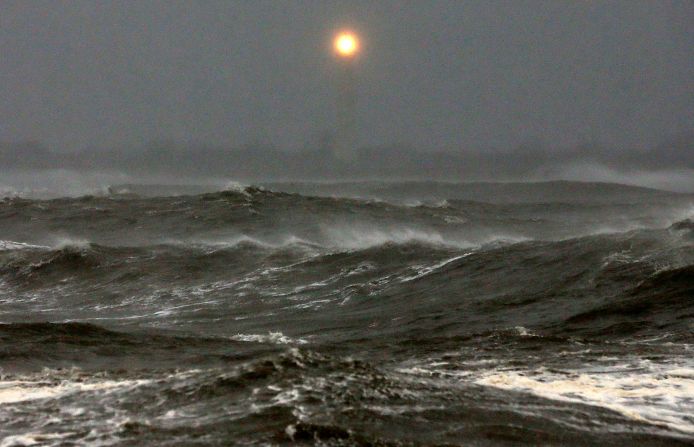 Cape May Lighthouse shines over the heavy surf.
