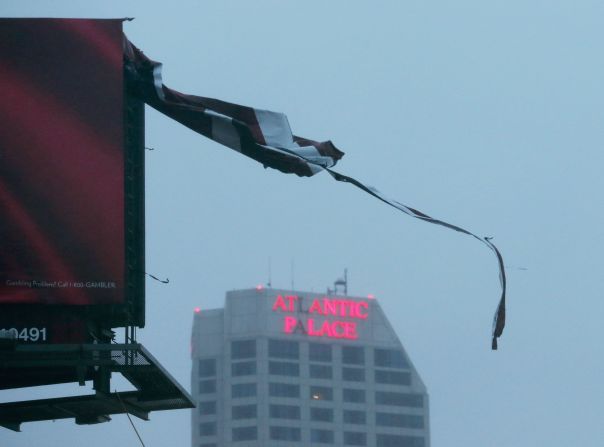 A tattered piece of a billboard blows in the wind Monday in Atlantic City, New Jersey.